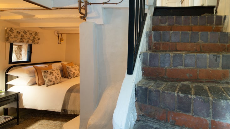 The stairs and bedroom at Town Walls Tower, Shropshire